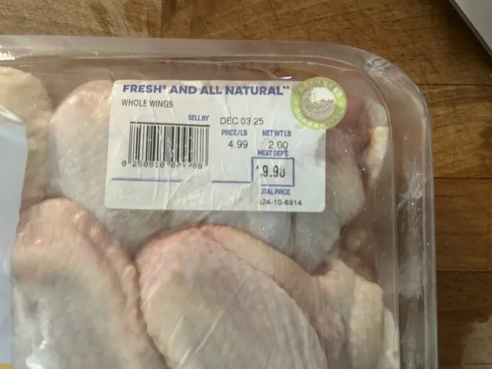 Perdue chicken wing package label showing 2.00 pounds at $4.99 per pound