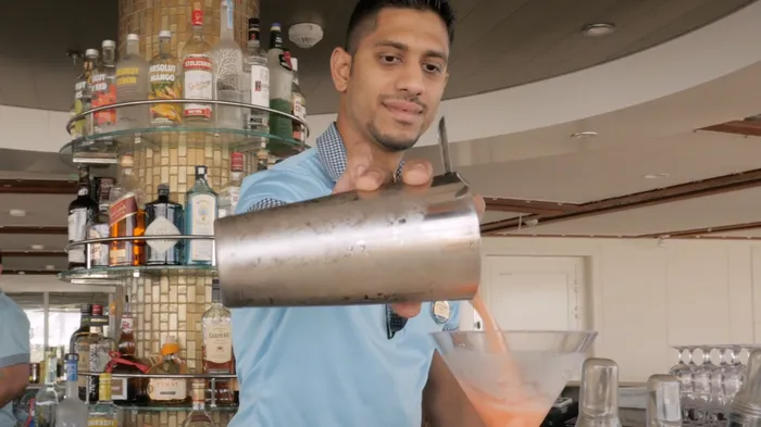 Royal Caribbean bartender pouring drinks