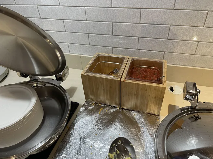 The hotel breakfast bar cheese bin after the moldy cheese was replaced