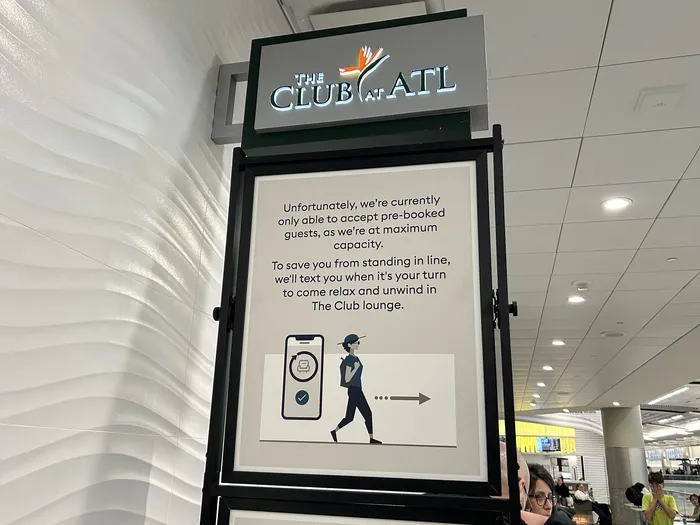 QR code sign for The Club at ATL waitlist