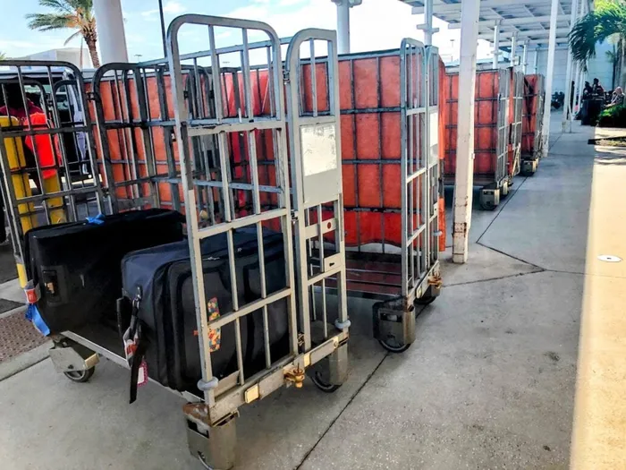 Cruise terminal porter tagging luggage curbside