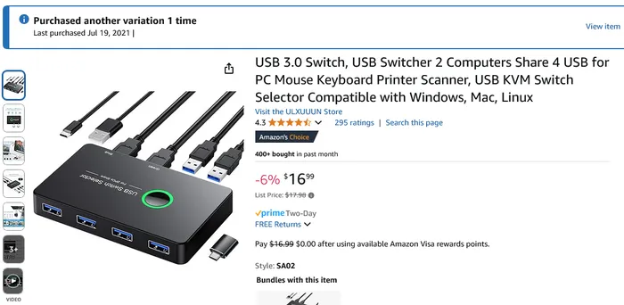Conmutador USB compacto conectado a teclado, mouse, cámara web y bocina